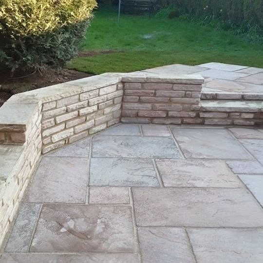Indian stone patio with low stone walling