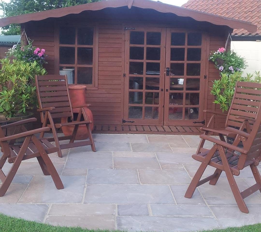 Indian stone patio in front of a summerhouse